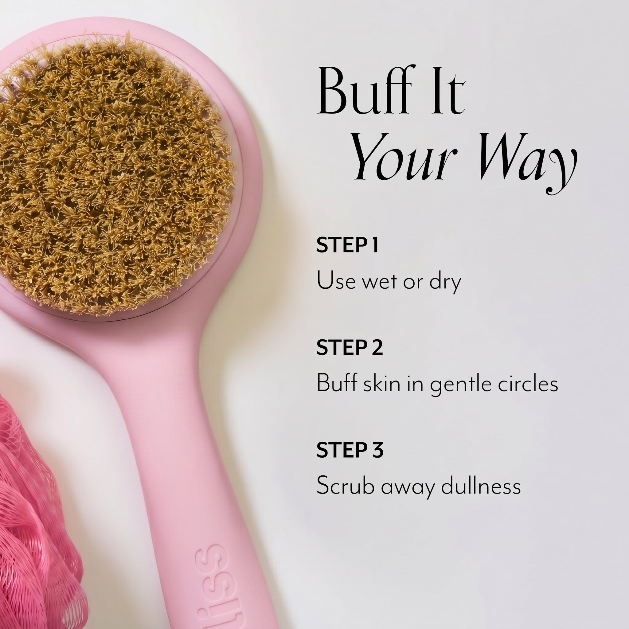 Pink skin brushing tool with brown bristles on a light gray background, featuring text instructions.